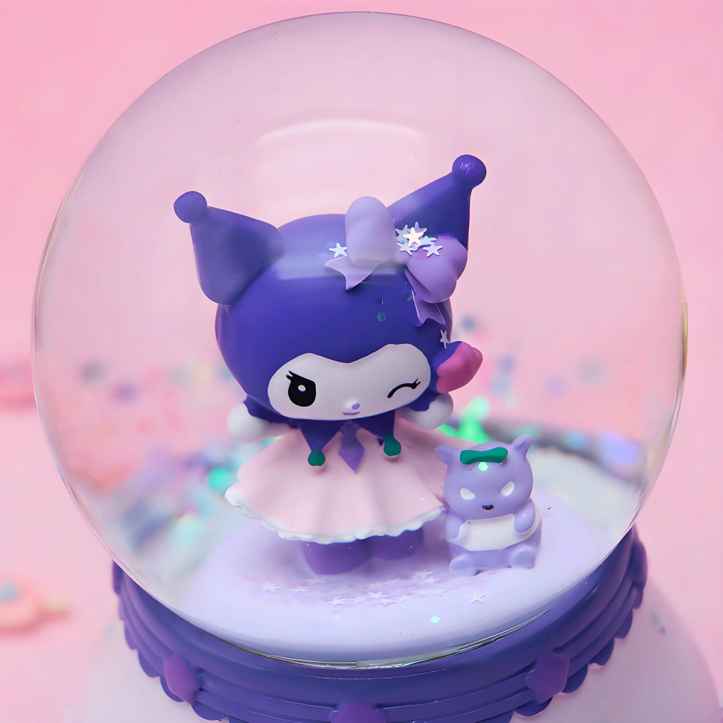 Side view of rabbit snow globe with dessert-themed purple base and clear dome.