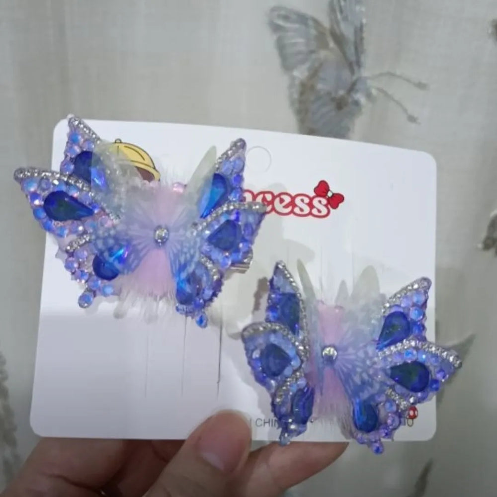 Butterfly hair clip with realistic fluttering motion caused by hidden spring mechanism