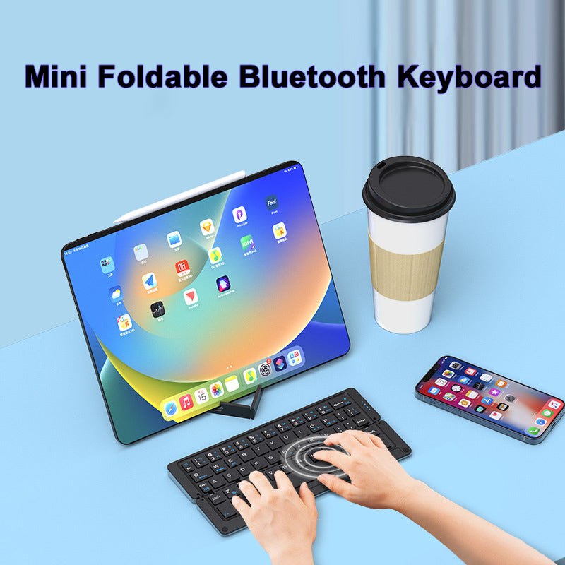 Compact foldable Bluetooth keyboard with magnetic device stand, compatible with iOS, Android, Windows, macOS