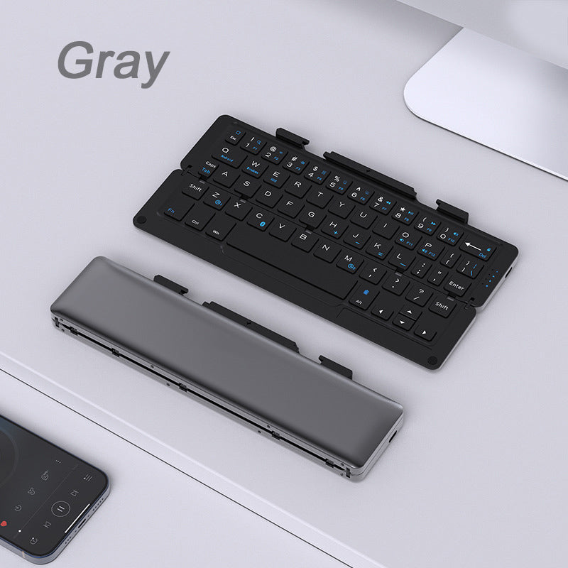 Compact foldable Bluetooth keyboard with magnetic device stand, compatible with iOS, Android, Windows, macOS