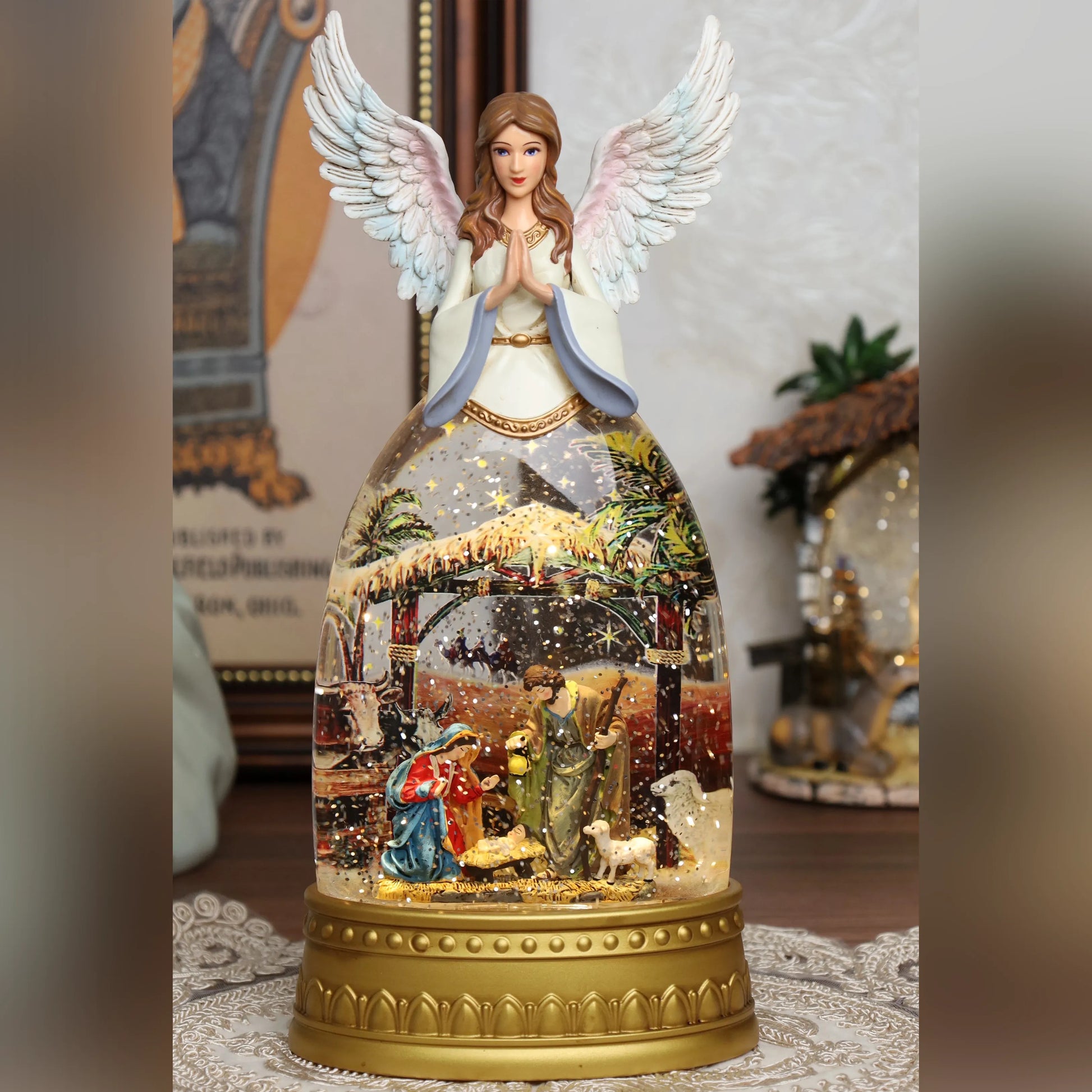 Nativity scene musical snow globe with snow effect and illuminated base