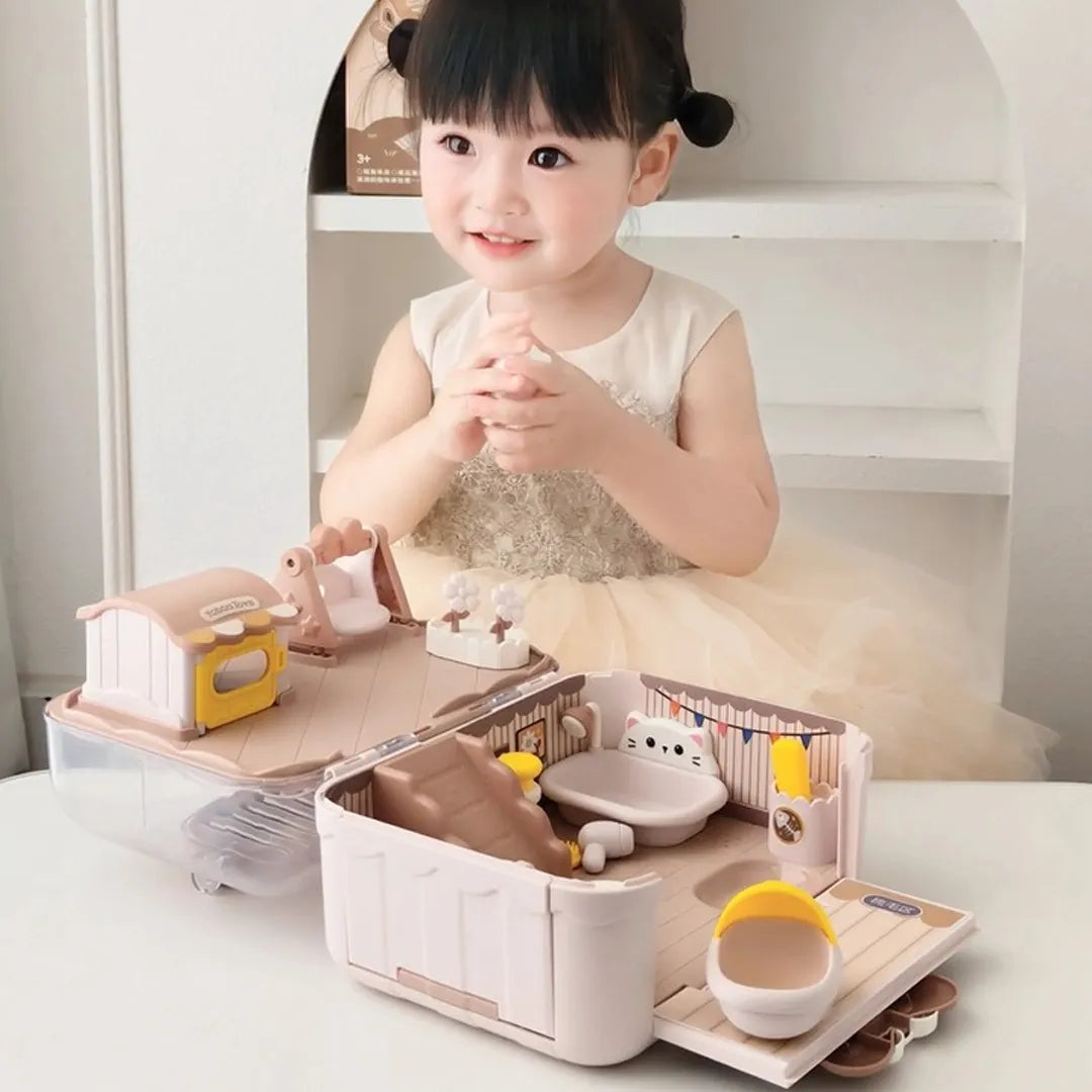 Child playing with a toy kitchen set on a table