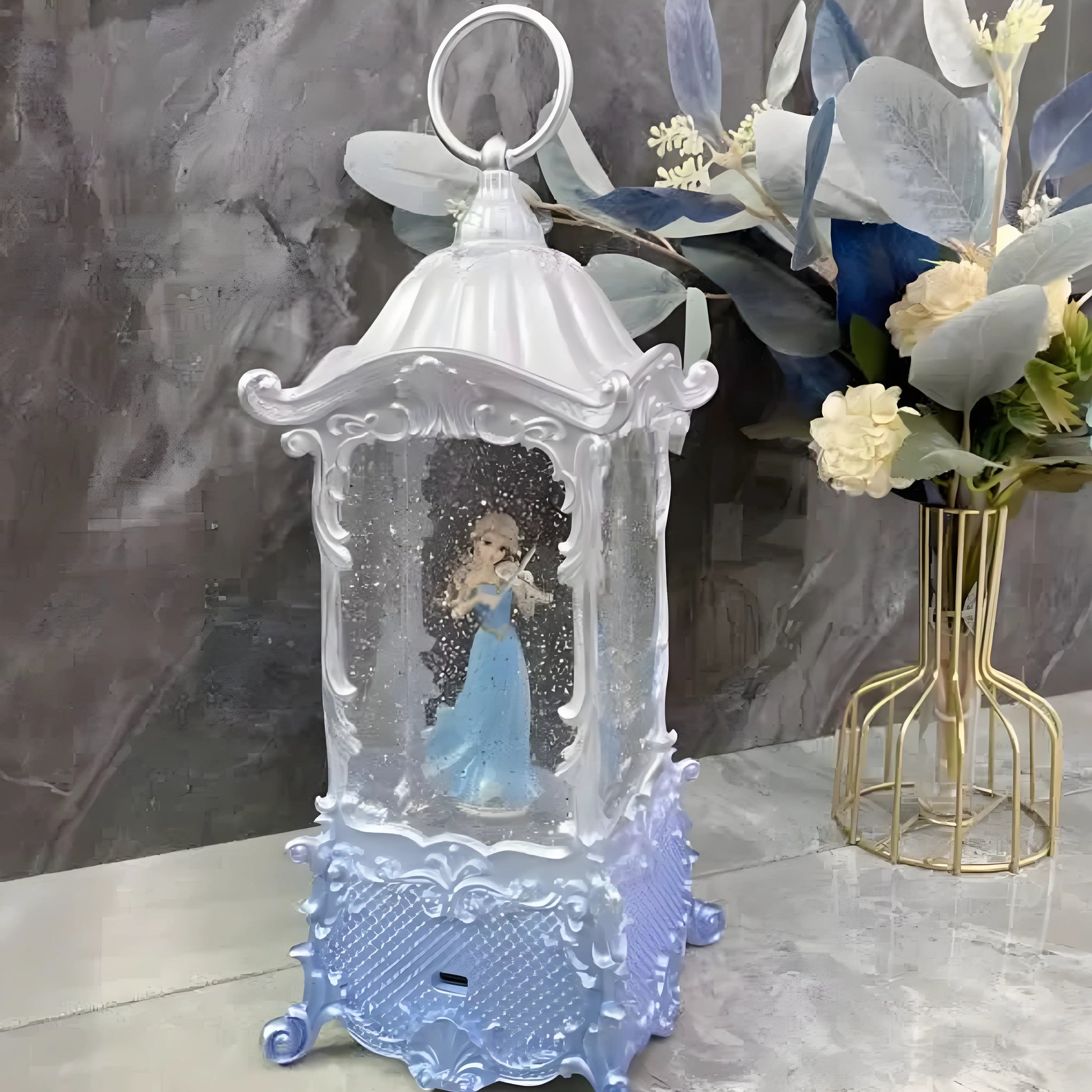 Holiday décor display featuring the glowing princess snow globe lantern