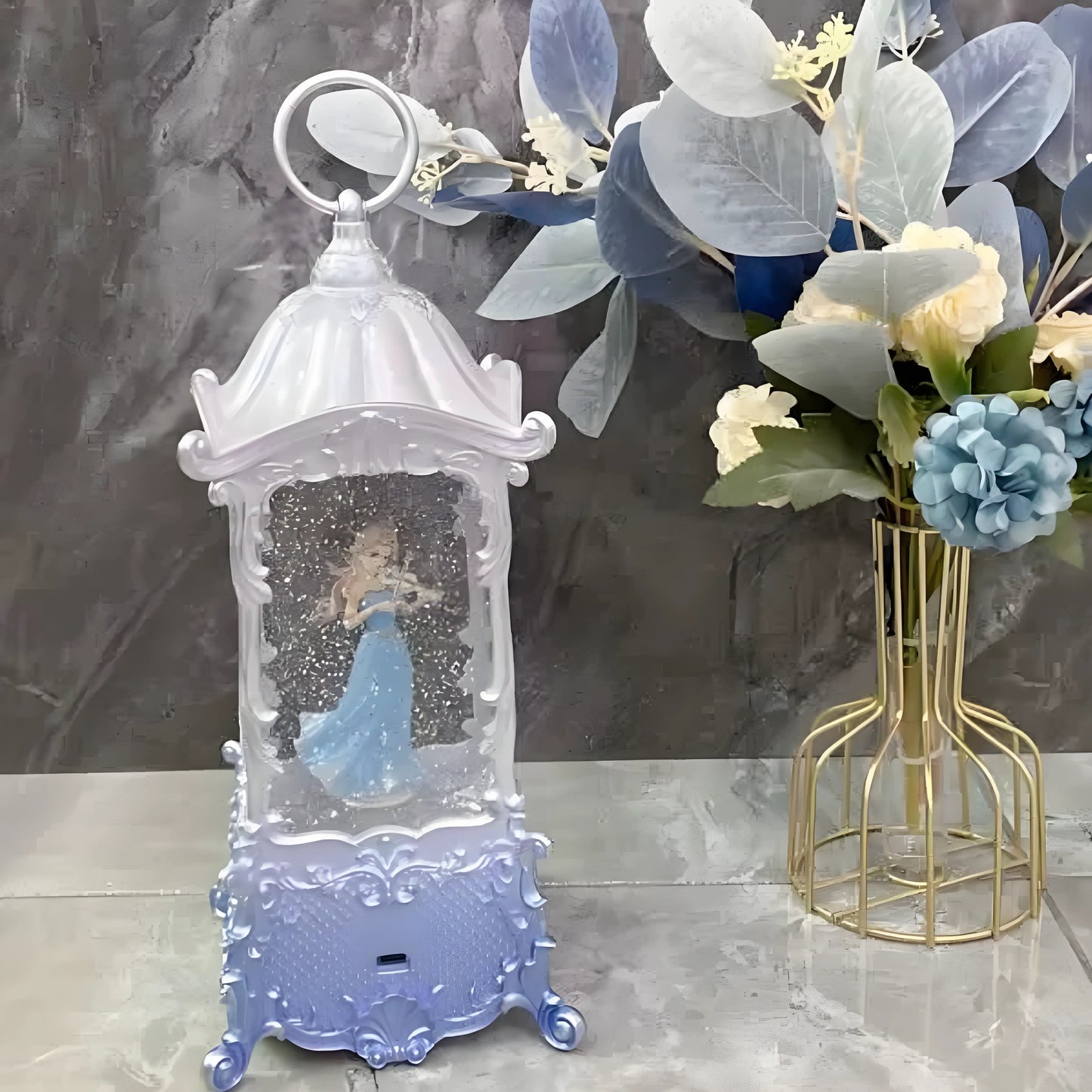 Unboxing view of the princess snow globe music box in gift packaging