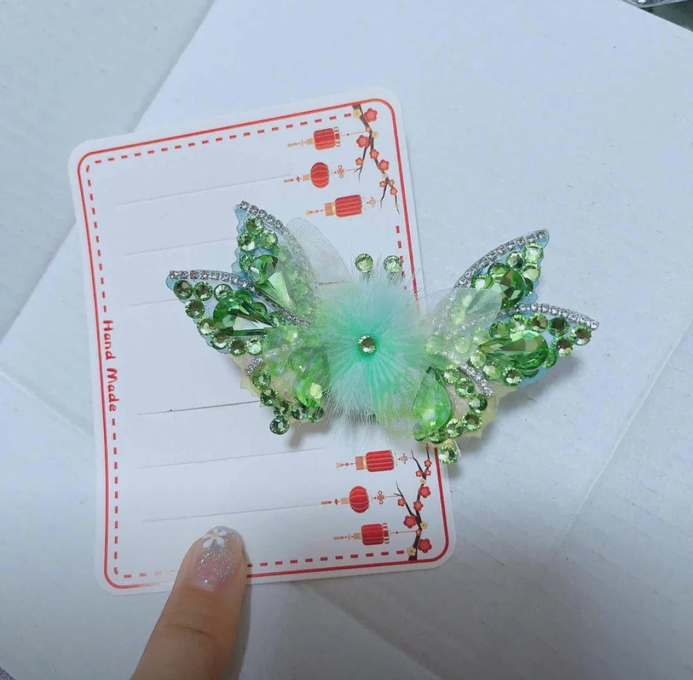 Sparkly butterfly hair clip worn in a ponytail adding playful movement and eye-catching charm