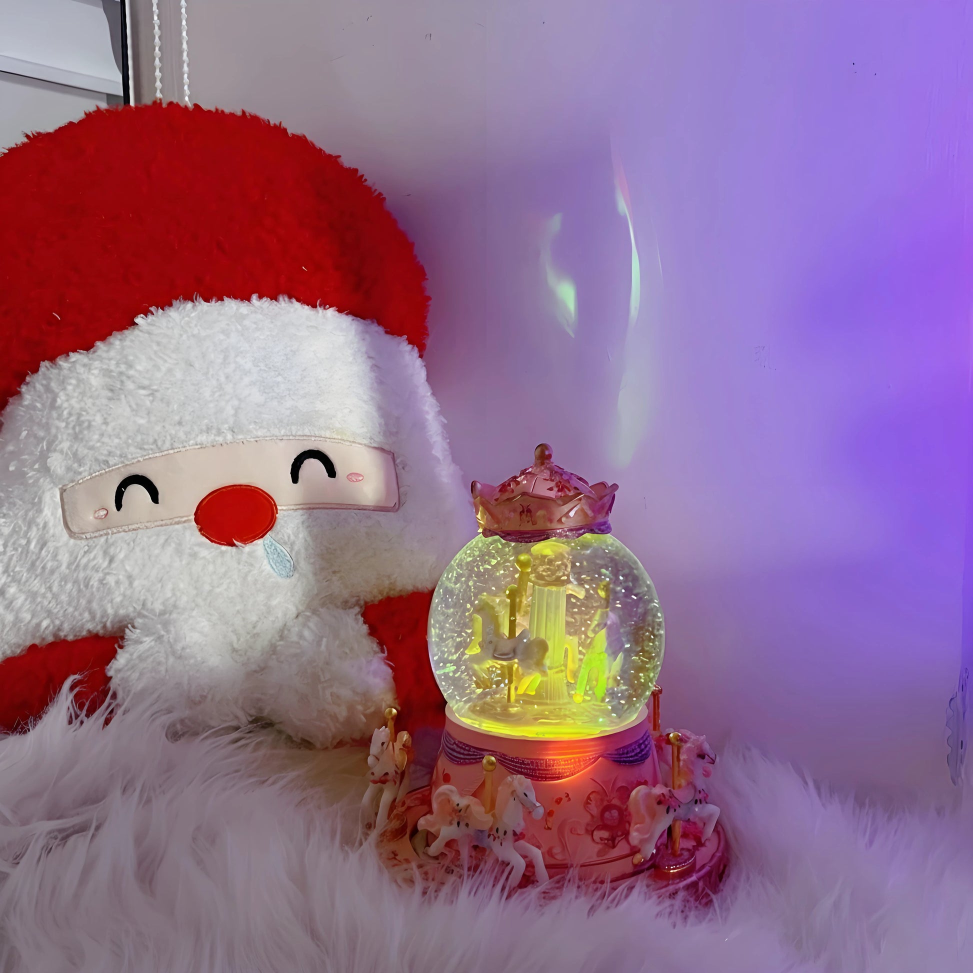 Snowman plush toy next to a glowing snow globe on a white surface with a purple background