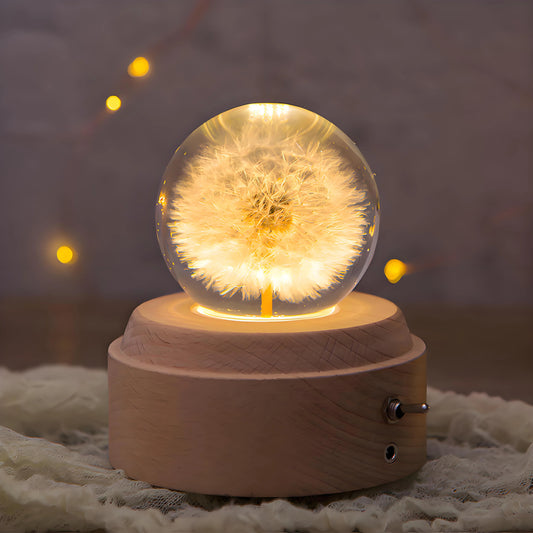 Decorative dandelion crystal night lamp music box placed on a desk, bedside table, or shelf, adding warm light, gentle rotation, and artistic charm to bedroom, living room, coffee shop, or hotel décor.