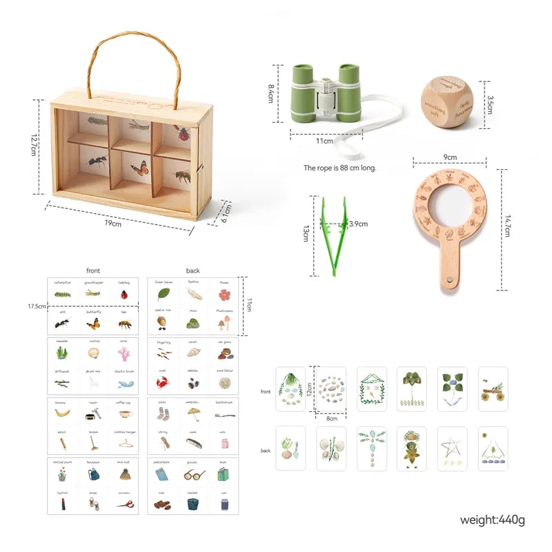 Children's nature exploration set with wooden box, binoculars,放大镜, and flashcards on a white background.