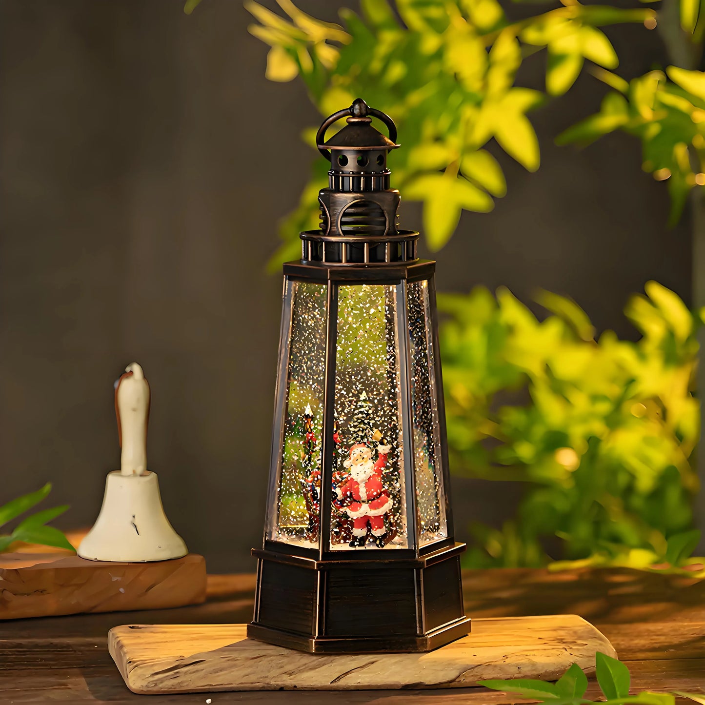 Macro shot of the Snowman and Deer figures inside the glitter globe, emphasizing the high-quality hand-painted craftsmanship and crystal-clear visibility.