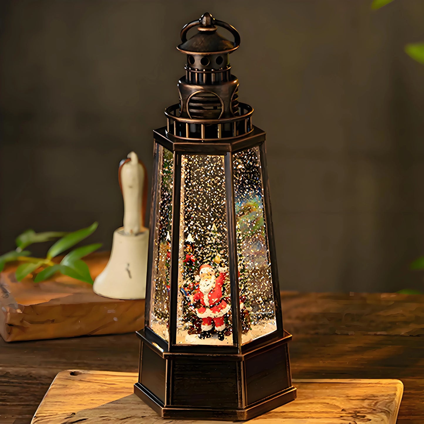 Close-up of the resin Santa figurine inside the water lantern, showing the intricate details of his red suit and the swirling silver glitter around him.