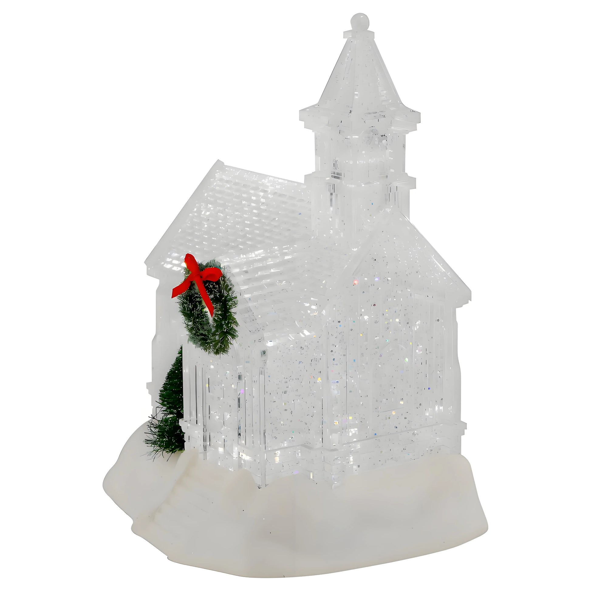 Decorative Christmas scene with a church model, wreath, and bow on a white background