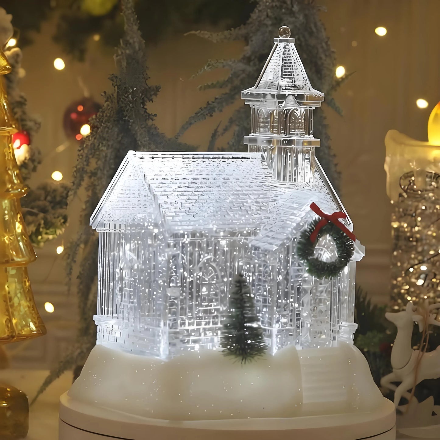 Decorative crystal house with a Christmas wreath on a blurred festive background