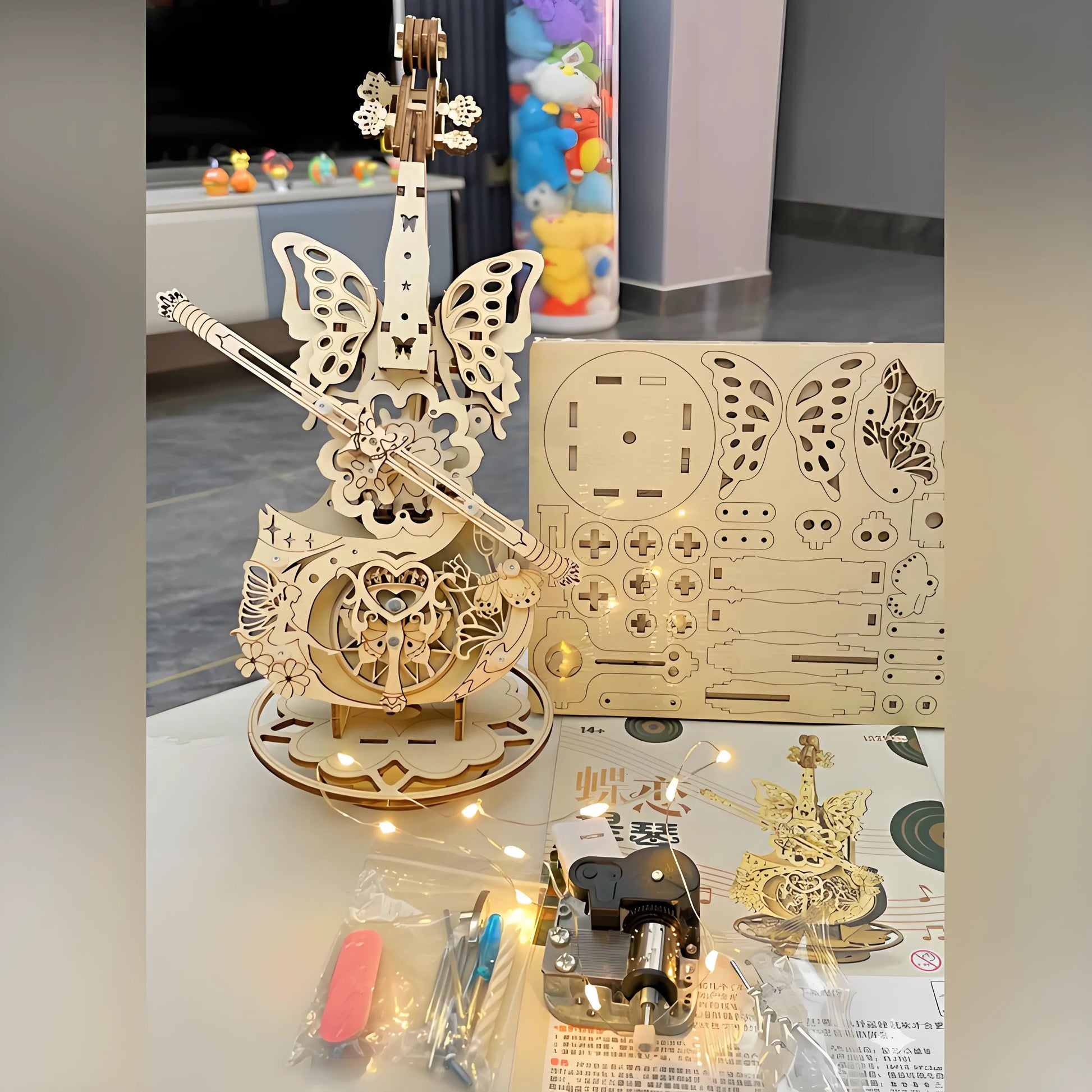 Finished wooden cello music box displayed on shelf – elegant home décor and craft project