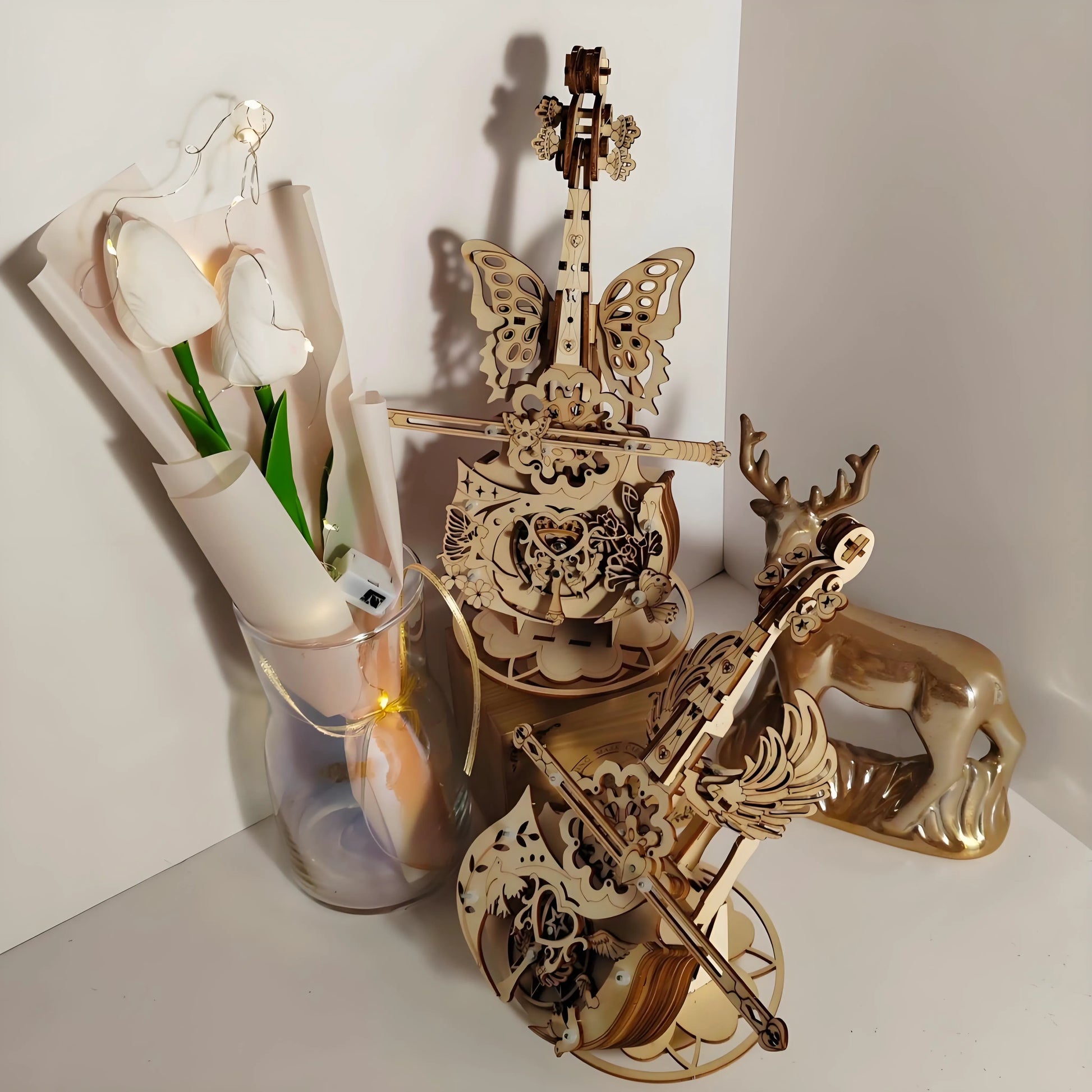 Finished wooden cello music box displayed on shelf – elegant home décor and craft project