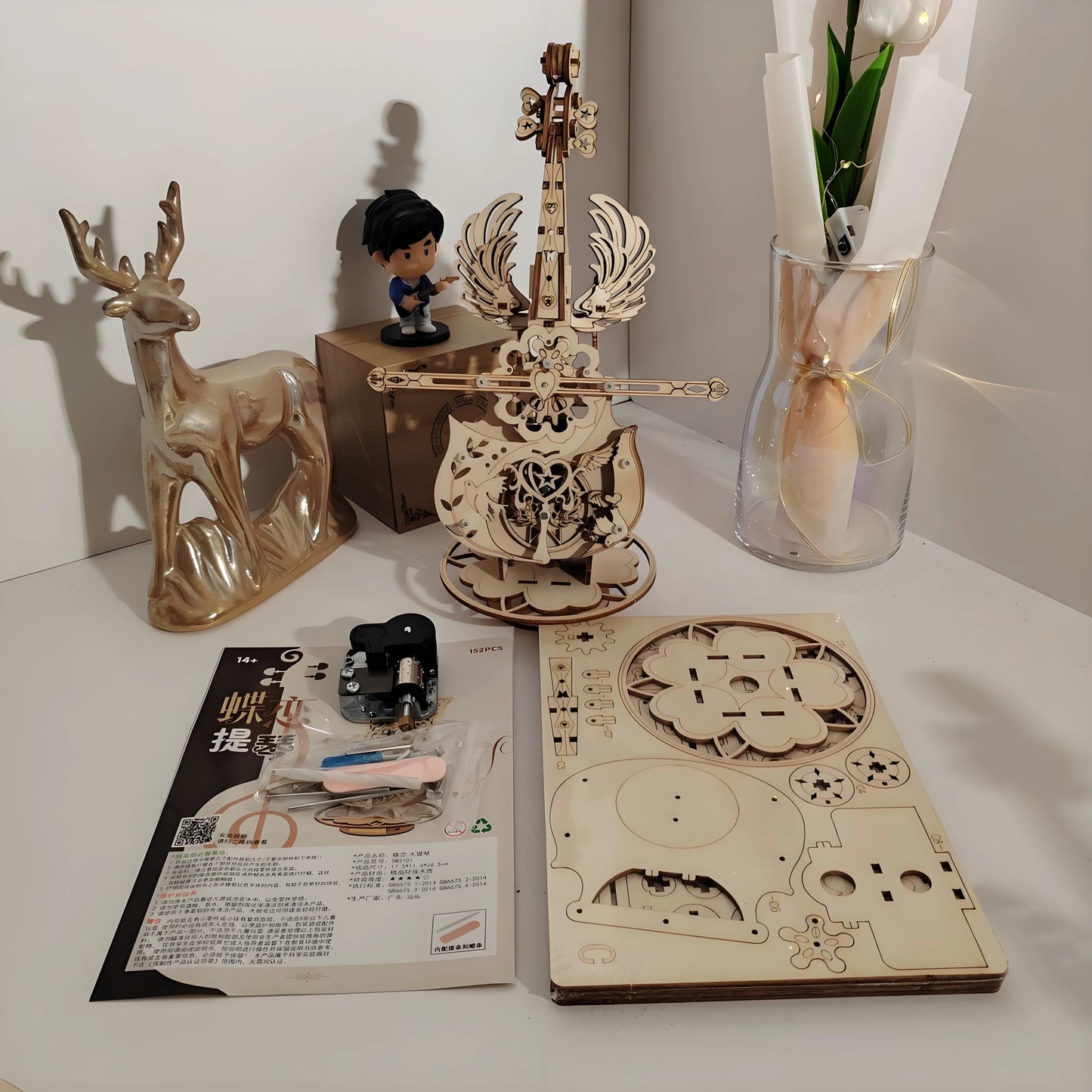 Wind‑up mechanical movement inside the wooden cello music box – no batteries needed