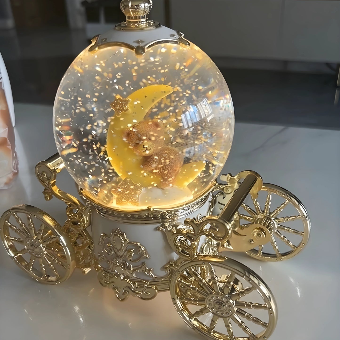 Pumpkin carriage snow globe with detailed figurine craftsmanship and smooth finish