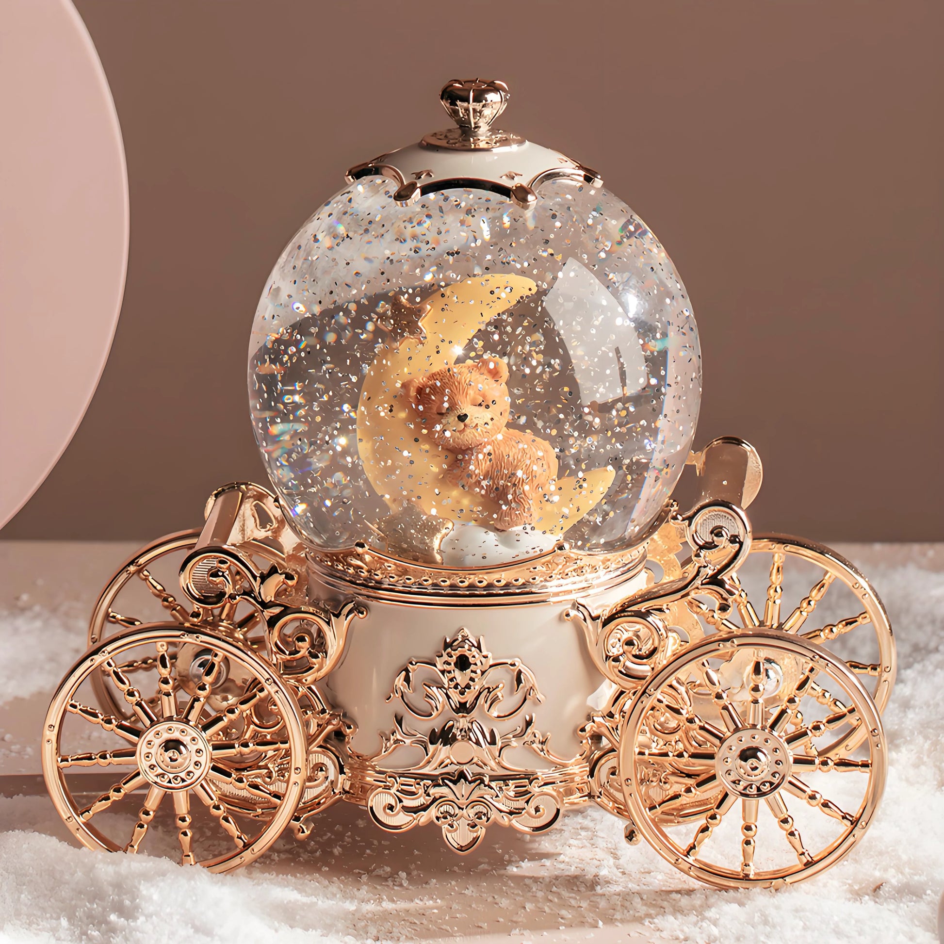 Musical snow globe pumpkin carriage shown in real-life home décor setting on shelf