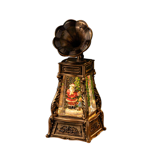 Phonograph style snow globe used as Christmas gift décor on table beside wrapped presents.