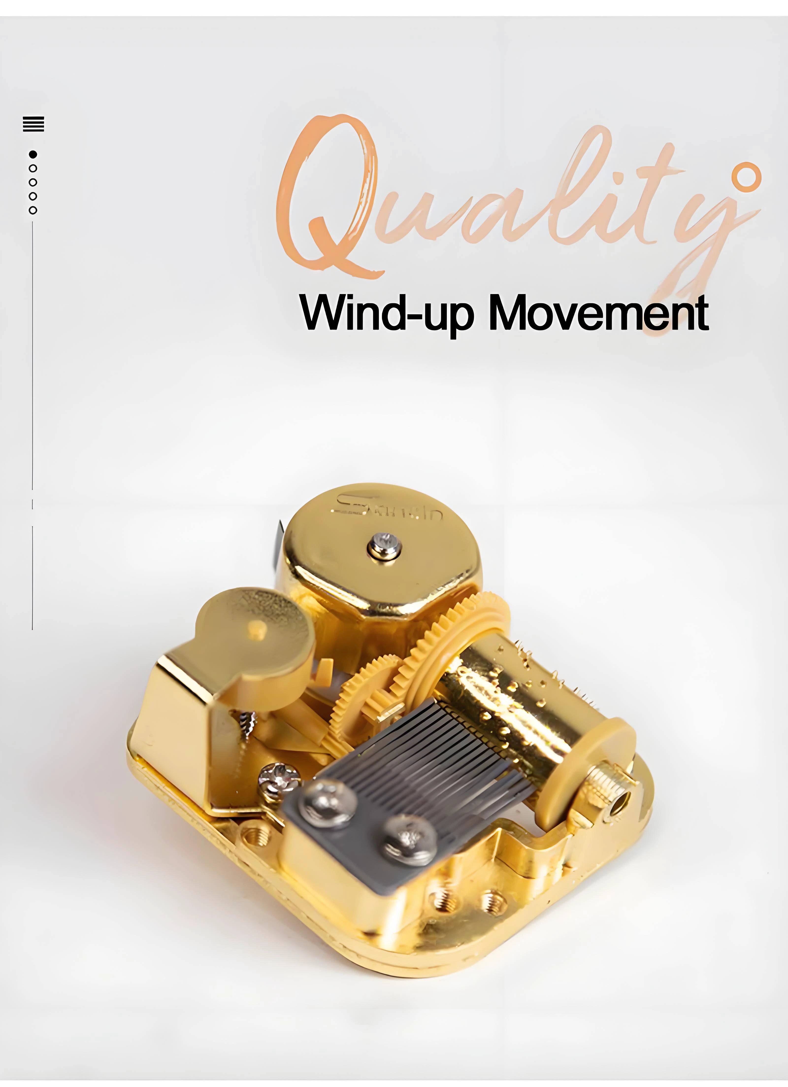 Small retro wind-up music box, transparent case revealing gears and golden metal movement