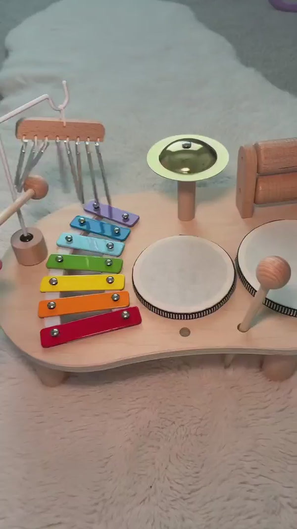 Indoor toddler activity focused on sound, rhythm and creativity