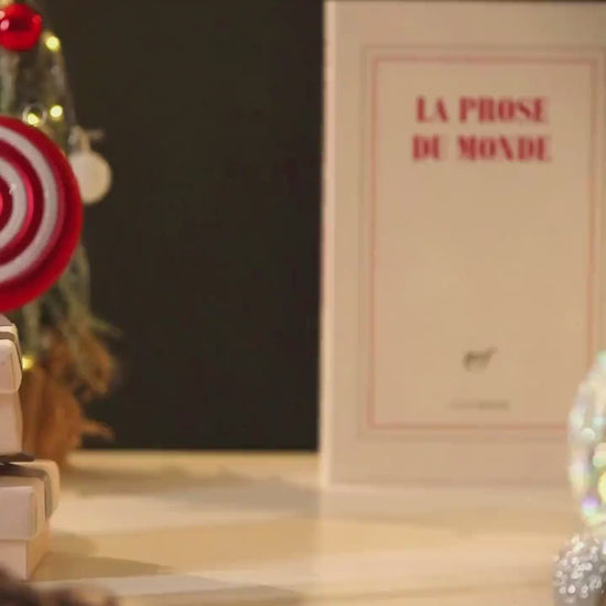 Glittering snow swirling inside the Christmas carriage music box